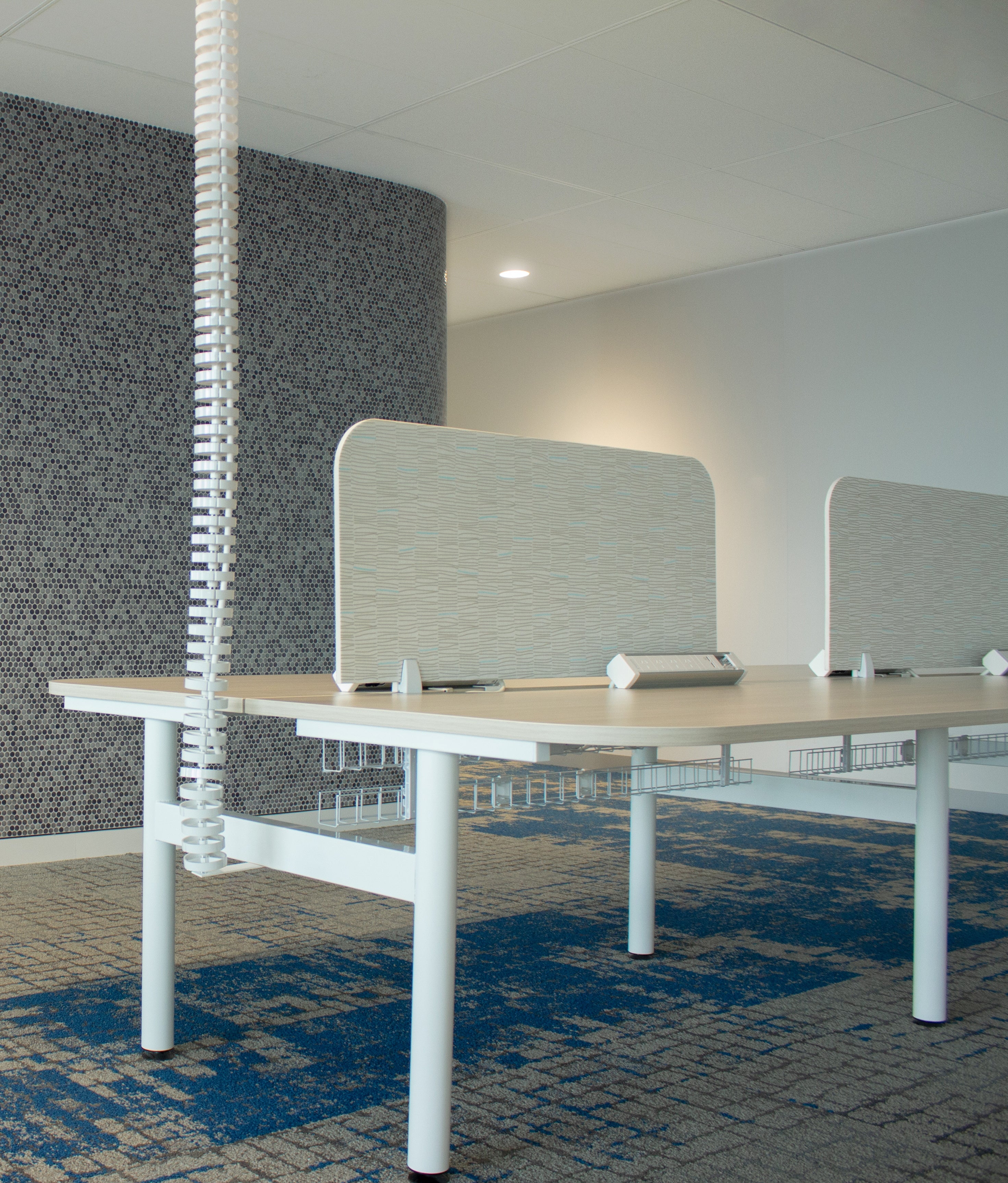 umbilical cord from the ceiling to the desk